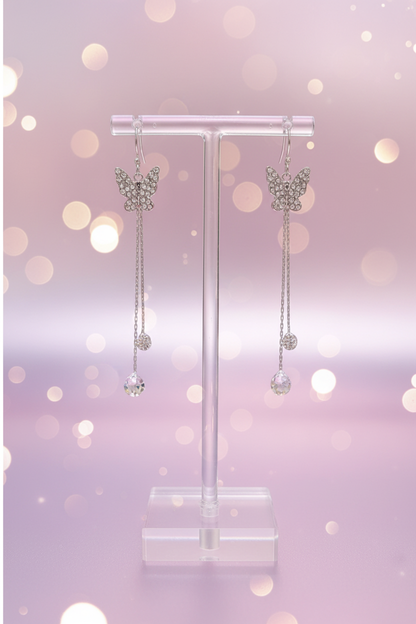 Crystal butterfly earrings on display stand