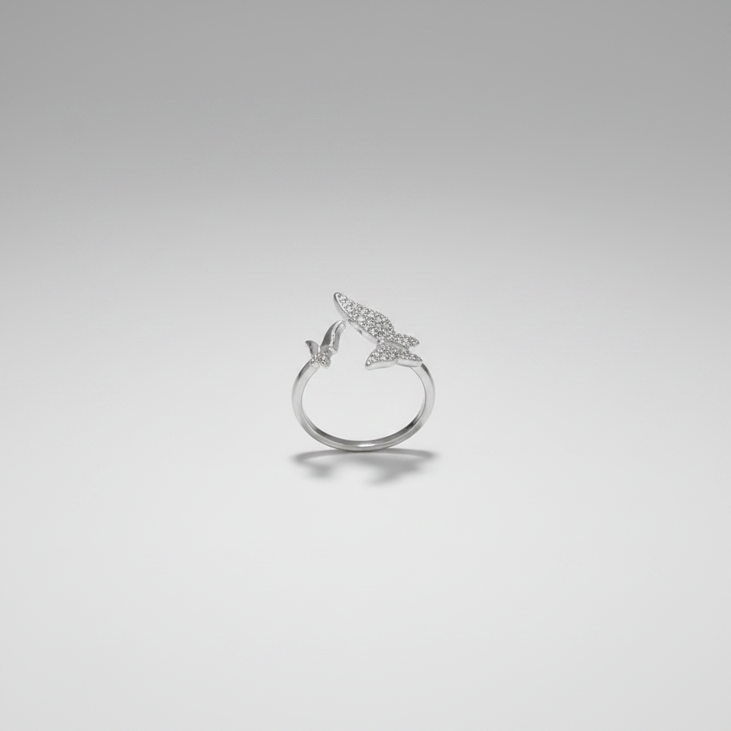 Flutter Wing Double Butterfly Crystal Ring - Silver - upright close-up on grey surface