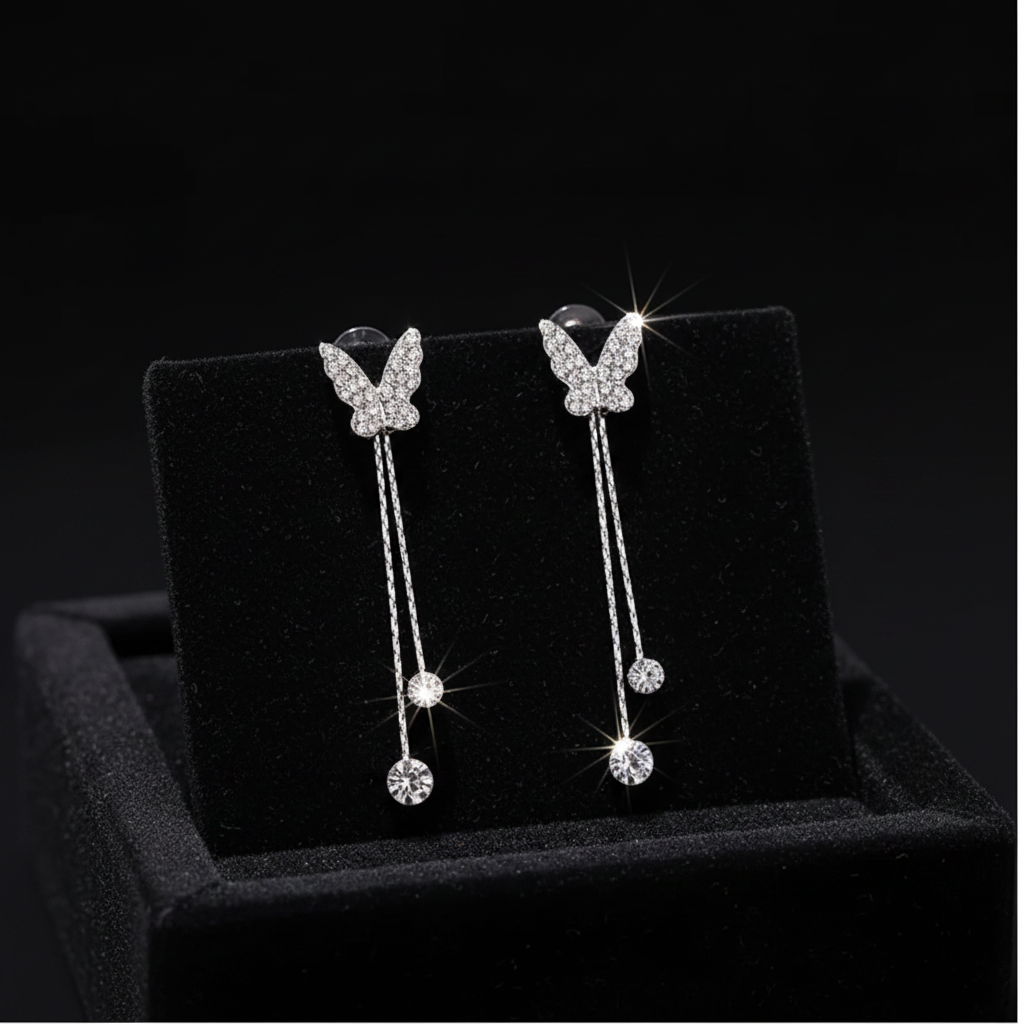 Crystal butterfly earrings on black velvet