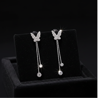 Crystal butterfly earrings on black velvet