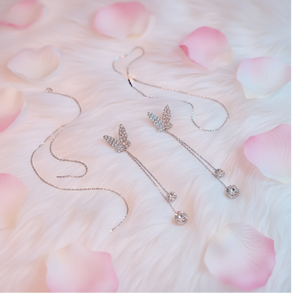 Crystal butterfly earrings fluffy floral flat lay
